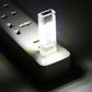 Double-sided USB LED light with clear case and visible LED board, lit