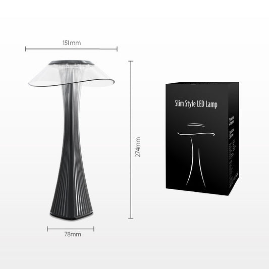 Compact LED table lamp with flared metallic shade and dark ribbed base.