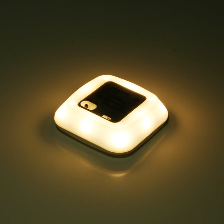 Square LED sensor light glowing warm white with round detector window