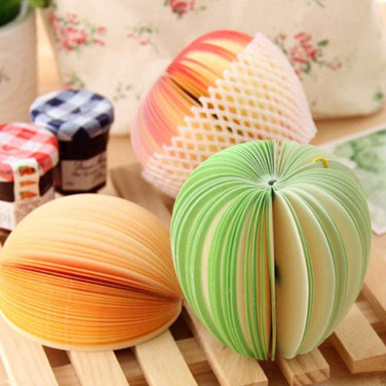 Group of accordion fruit note stickers in orange, yellow, and green on wooden stands