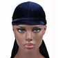 Navy velvet turban cap with wide band and long back drape tail