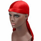 Red velvet turban cap with wrapped band and long trailing side tail