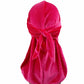Hot pink velvet turban cap with gathered knot and long trailing tail