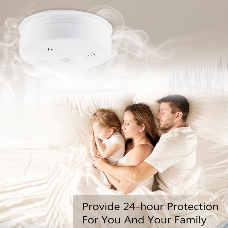 White ceiling smoke and heat detector with central indicator and vent openings
