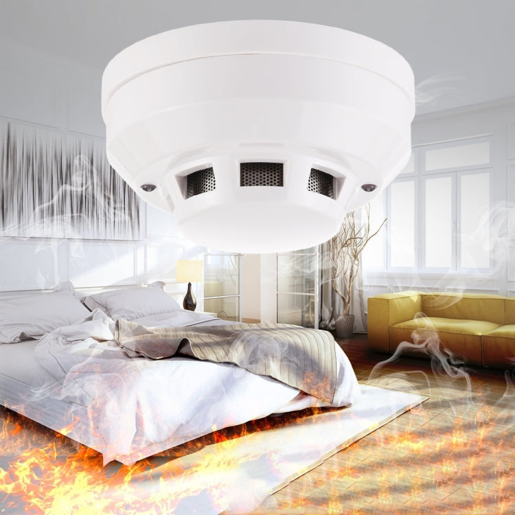 Photoelectric smoke detector with red LED indicator, white ceiling-mount housing.