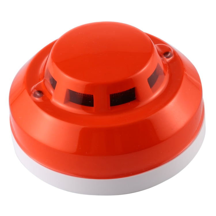 Photoelectric smoke detector base with red outer cover and vent openings.