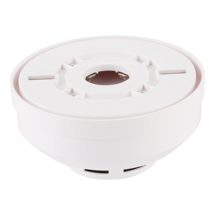 Photoelectric smoke detector underside with mounting pins and central sensor window.
