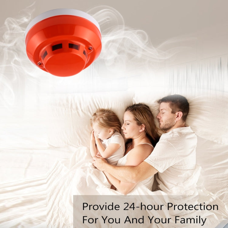 Photoelectric smoke detector with red cover, smoke-like visual around ceiling fixture.