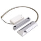 Door magnetic detector with grey sensor bars, white wireless module, and coiled lead
