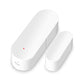 White door/window sensor pair with magnet contact, oval housings and red LED dot