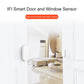 White wireless door/window contact sensor pair on door and window frame
