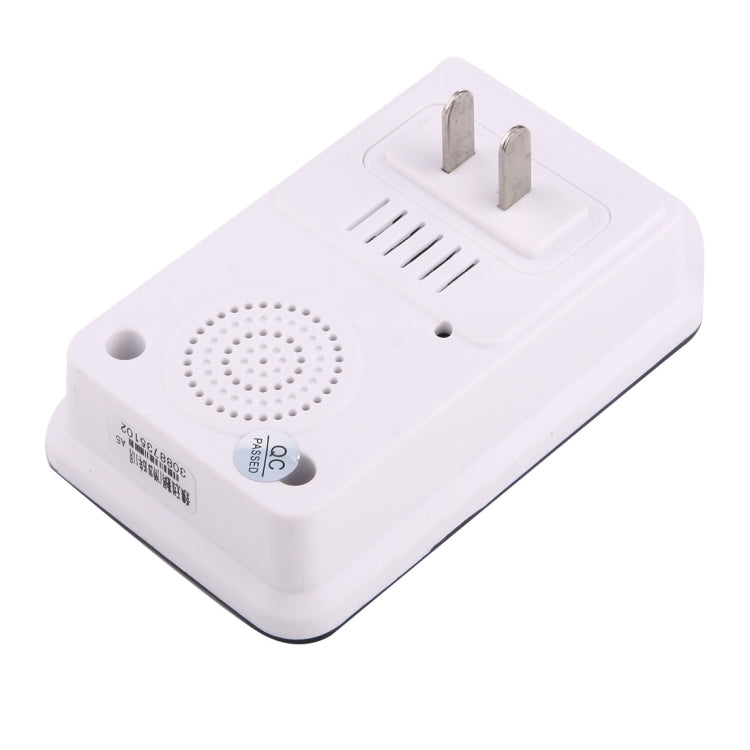 Wireless doorbell transmitter back with speaker grille and mounting prongs on white body