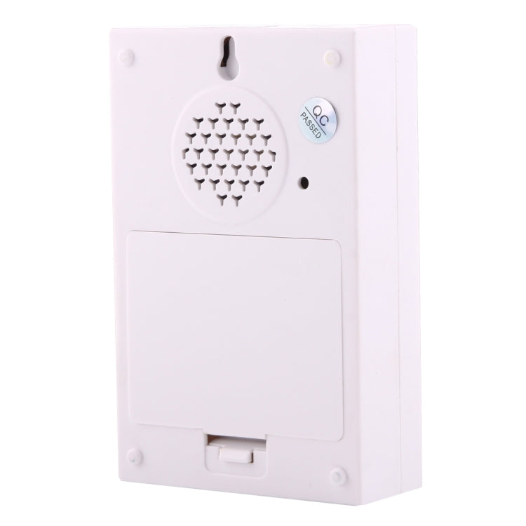 White wireless doorbell transmitter with speaker grille and pairing button