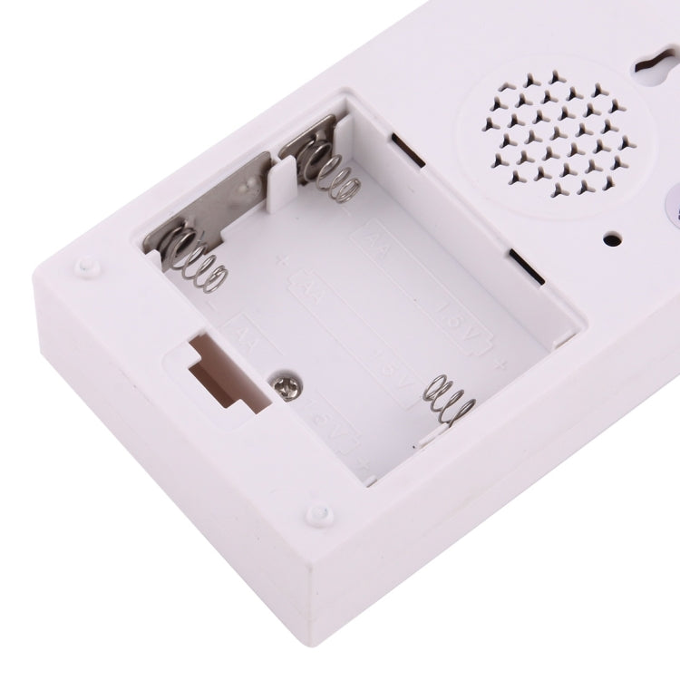 White wireless door chime battery compartment with spring contacts