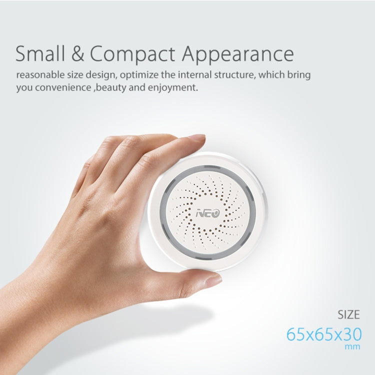 Compact white WiFi siren alarm sensor held in hand, circular speaker grille