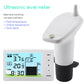 Ultrasonic liquid level meter with white transmitter unit and LCD receiver screen