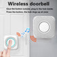 Wireless doorbell kit with wall chime and push button, hand pressing the button