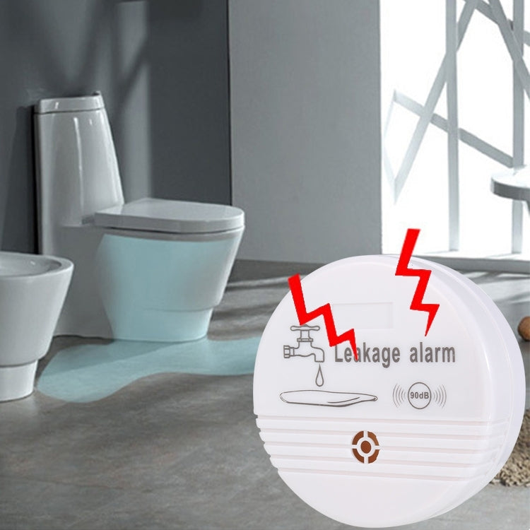 White round water leak alarm sensor with leak icon and 90dB speaker markings