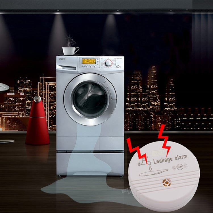 White round leak alarm sensor with faucet icon and 90dB marking
