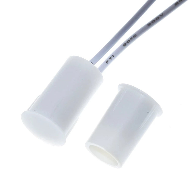 Door magnetic sensor switch sensor housing pair with attached leads and printed markings