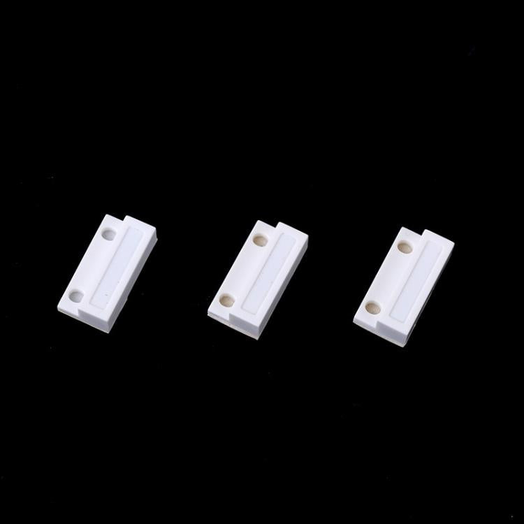 White magnetic sensor contact blocks, three pieces with mounting holes
