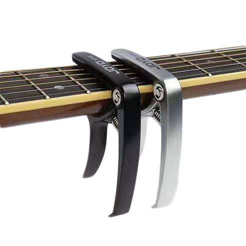 Silver zinc alloy guitar capo with black handle and dual spring arms