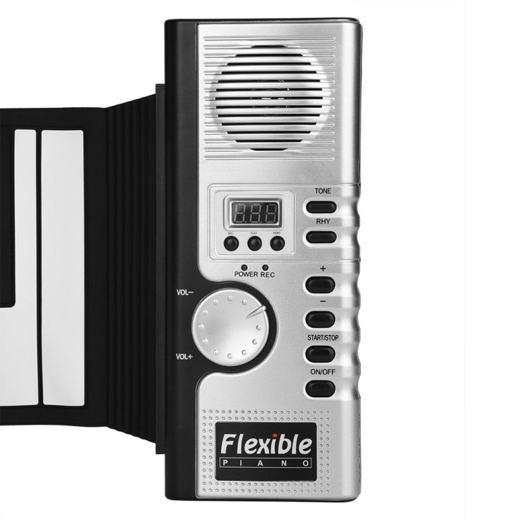 Roll-up keyboard piano control panel with speaker, volume dial, and power buttons