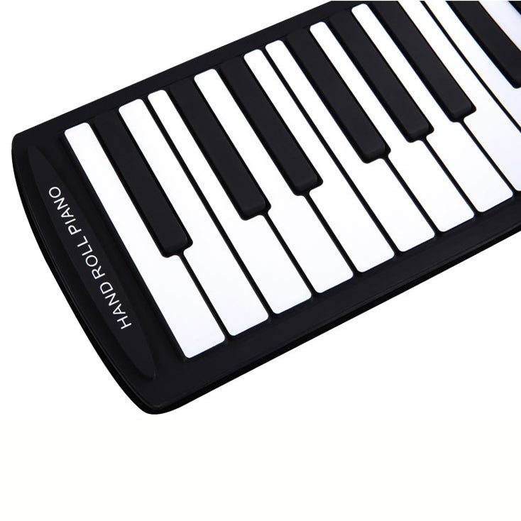 Flexible roll-up keyboard with black and white keys, compact folded design