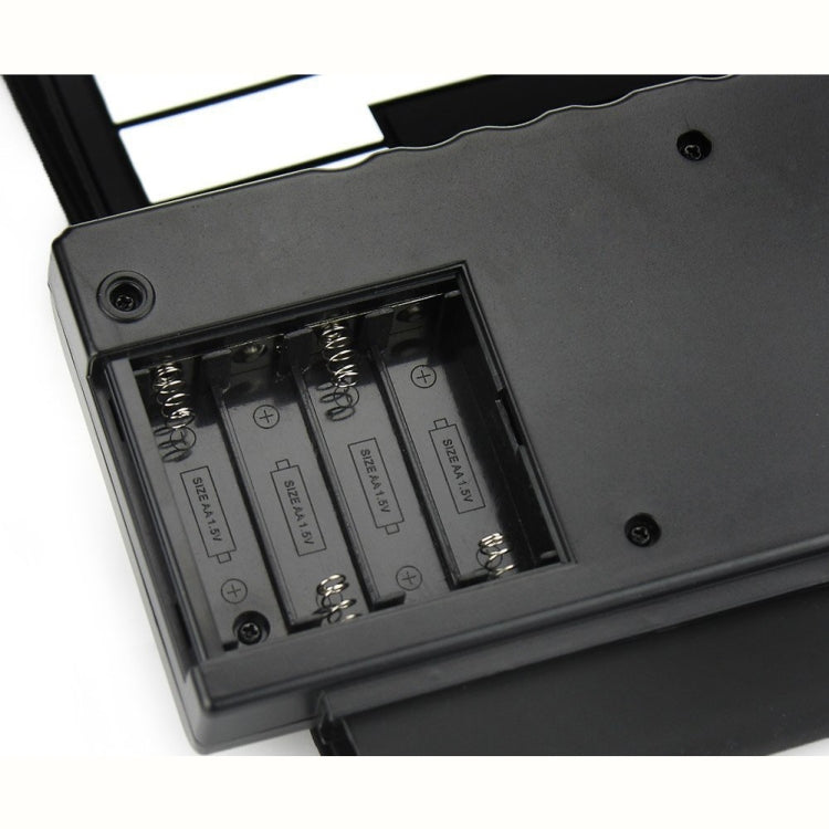 Underside battery compartment of a roll-up electronic keyboard piano