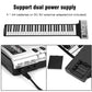Roll-up electronic keyboard piano showing dual power options for batteries or adapter