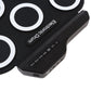 Portable electronic drum control panel on black silicone pad with buttons and ports
