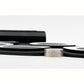 Close-up of black silicone electronic drum pads with raised circular striking surfaces