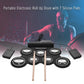 Black electronic roll-up drum with seven silicone pads and two wooden drumsticks