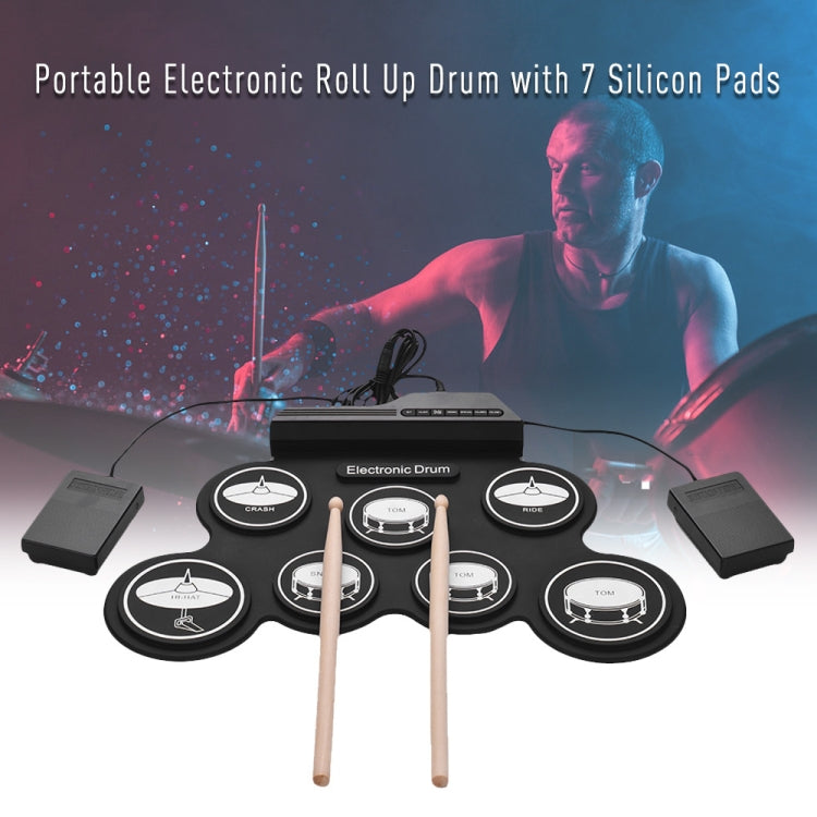Black electronic roll-up drum with seven silicone pads and two wooden drumsticks