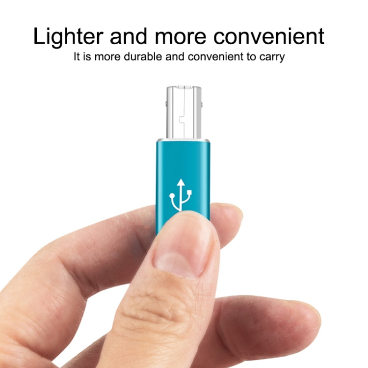 Blue Type-C to MIDI adapter held in hand, showing USB-C and MIDI ends
