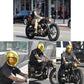 Motorcycle helmet bubble visor with yellow and tinted mirrored lenses, worn by rider