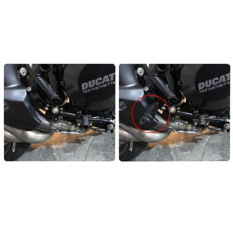 Installed black textured motorcycle footpegs on rear near engine, metal mounting end visible