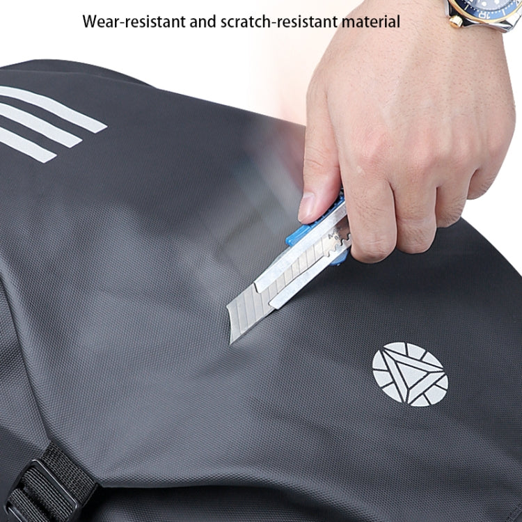 Dark gray motorcycle backpack with durable fabric, reflective logo patch, strap detail