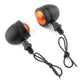 Black motorcycle LED turn signals pair with amber lenses and wire pigtails