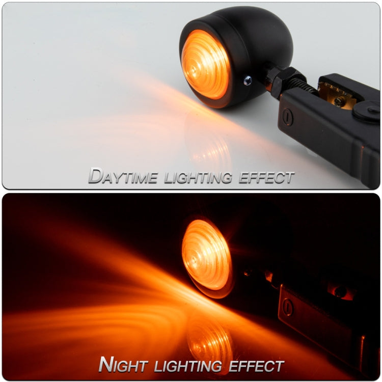 Black LED turn signal pair lit with bright amber beam effect