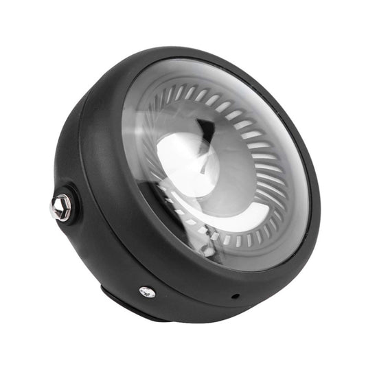 Black retro motorcycle LED headlight, angled view showing clear lens and metal mounting bolt