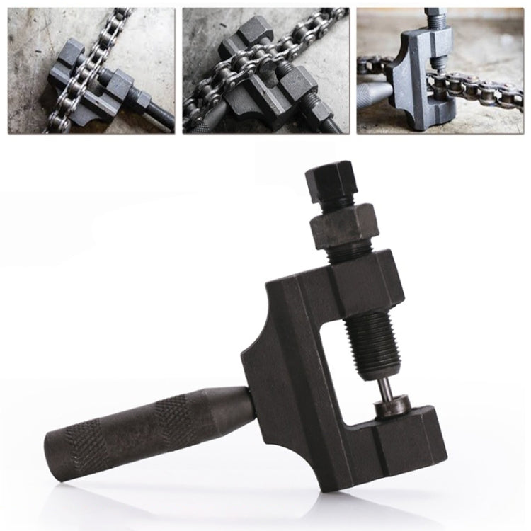 Chain removal tool with threaded press, clamped onto a metal bike or motorcycle chain