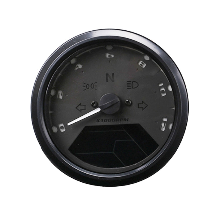 Round black motorcycle odometer gauge face with dial markings and dark LCD window