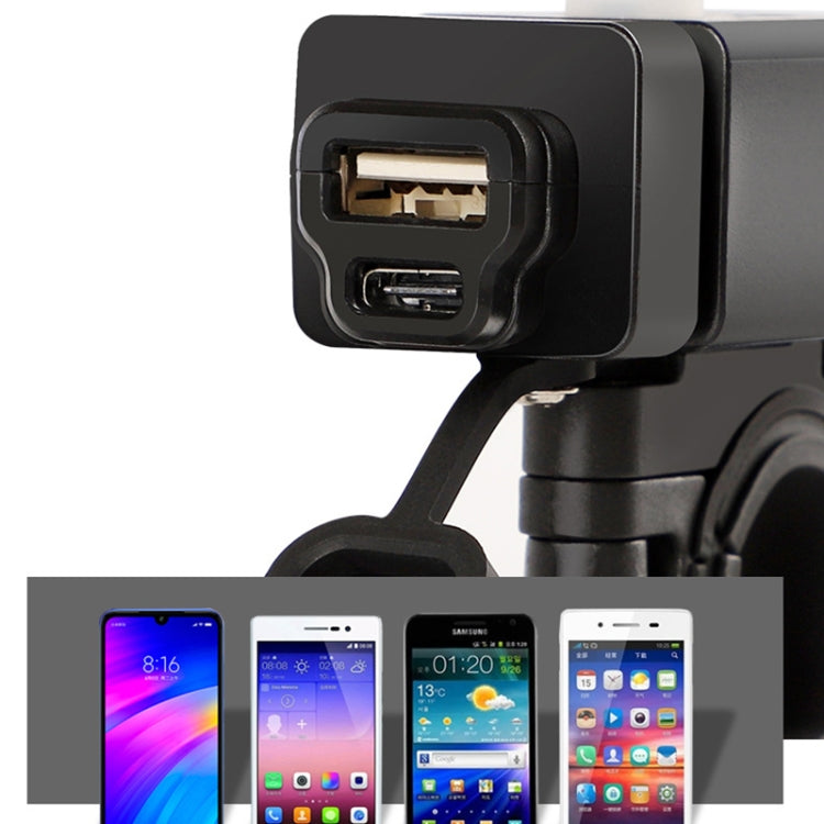 Black motorcycle phone charger with top USB port and bottom USB port, close-up on mount.