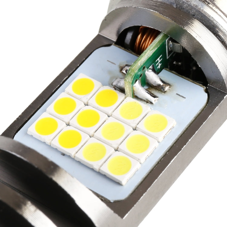Close-up of PX15D LED board with multiple yellow SMD LEDs and green wiring on silver housing