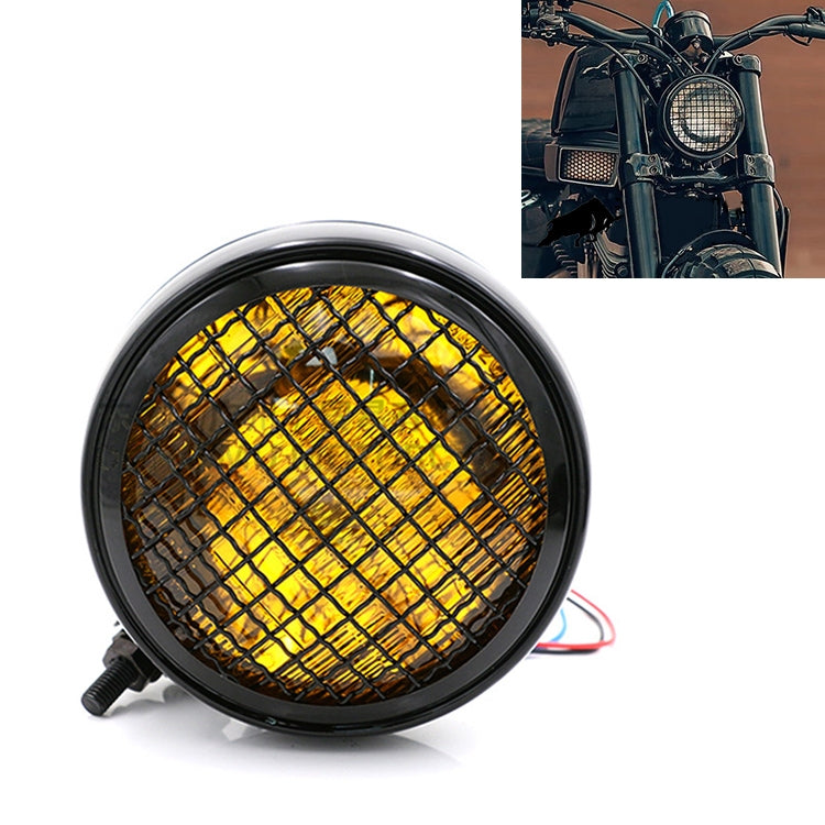 Black retro LED headlight with yellow-tinted grid lens and red wire leads