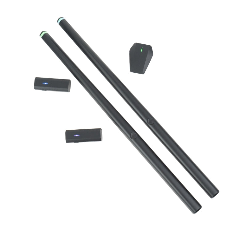 Virtual drum kit sensor sticks and small controller pads, dark with green indicator lights