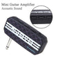 Mini guitar effects pedal with black patterned faceplate and side output jack.