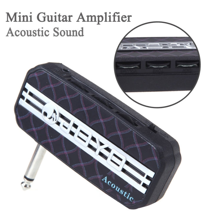 Mini guitar effects pedal with black patterned faceplate and side output jack.