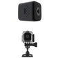 Black mini smart camera with front lens, side speaker holes, and rear port